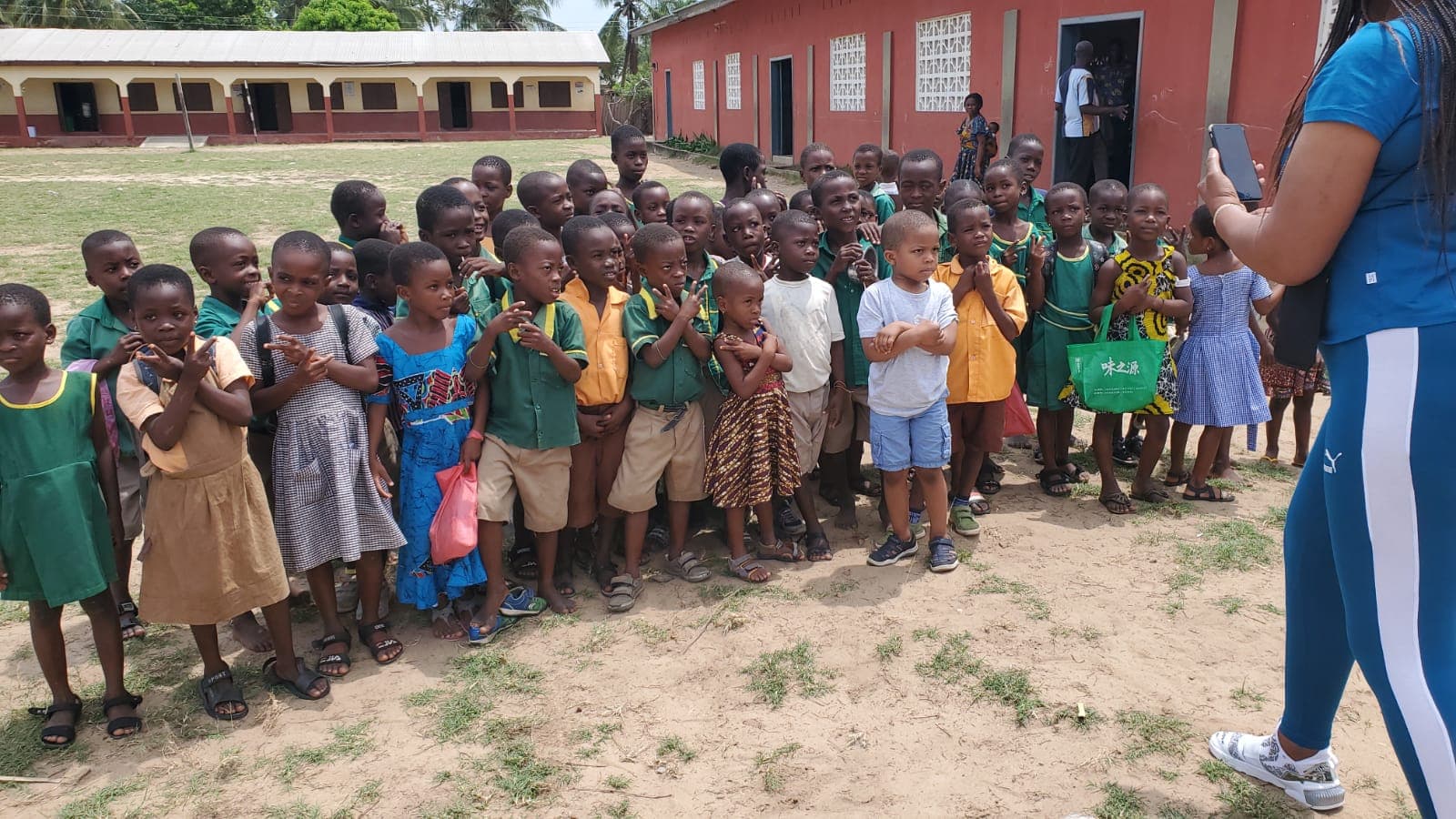 Students assembled for school supplies distribution