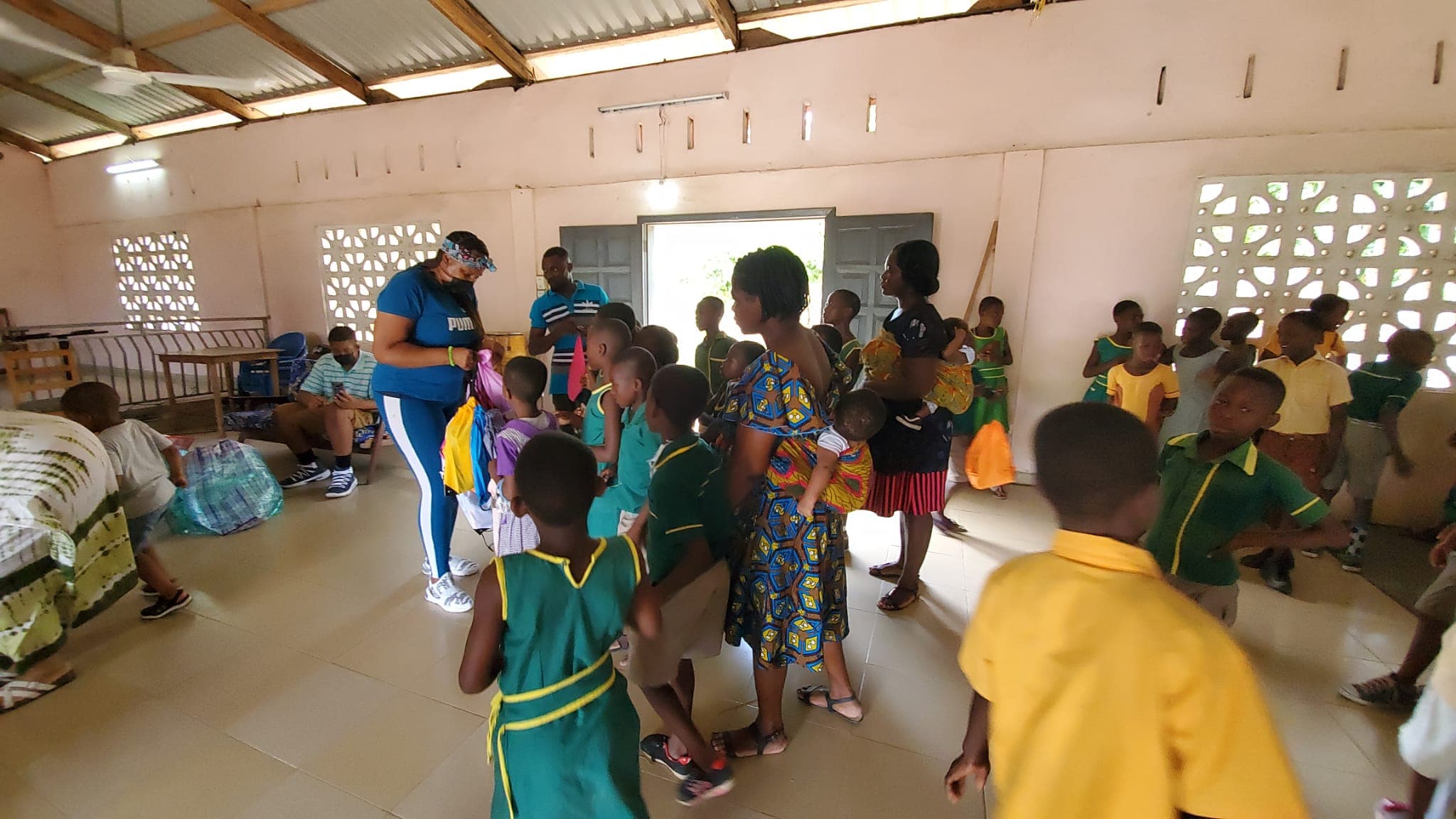 Distributing backpacks to students