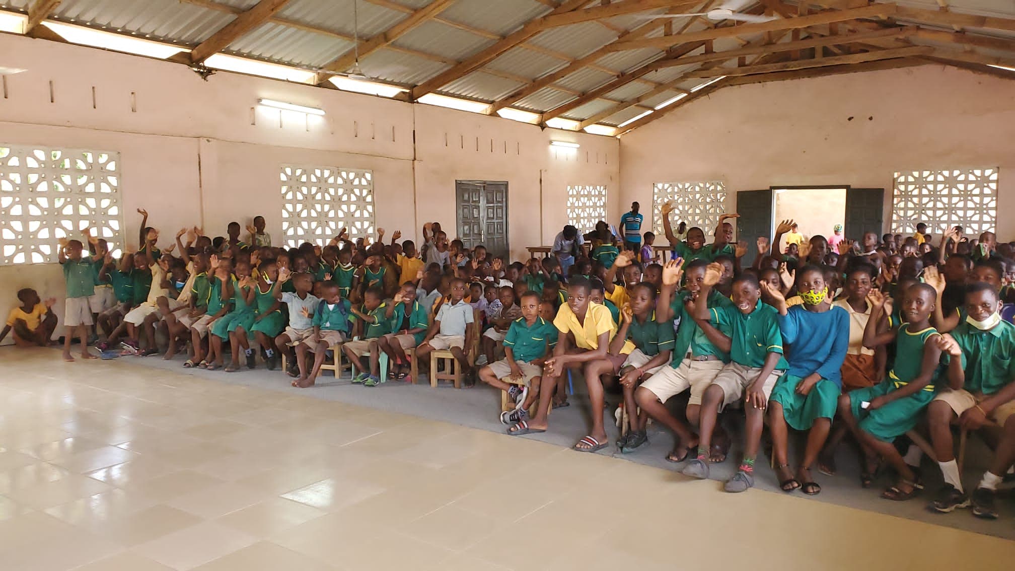 Students in class with new supplies